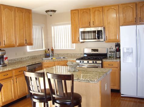 blue corian maple cabinets stainless steel appliances|maple cabinet designs.